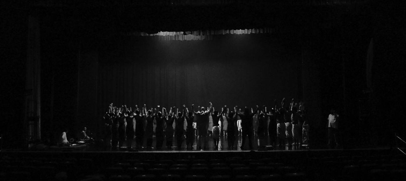 Performers on a dark stage in Piyush's Kalaripayattu photography series